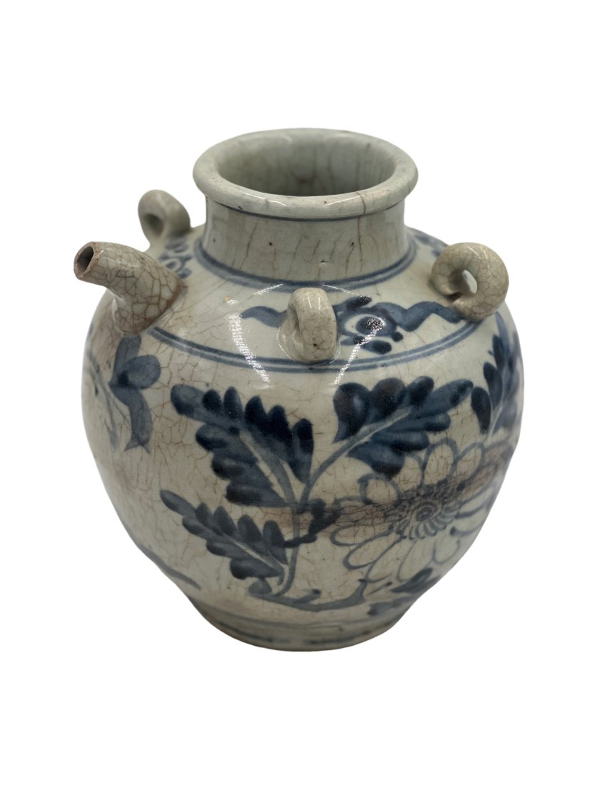 Chinese 16th Century Blue and White Wine Jar: Blue and white wine jar with a floral motif. 16th-17th century. Ming Dynasty. Measurements: 9" Height. Roughly 7.5" Width. Base 4.5"D. opening at top 3.5"W **SHIPPING on this item offered through, UPS