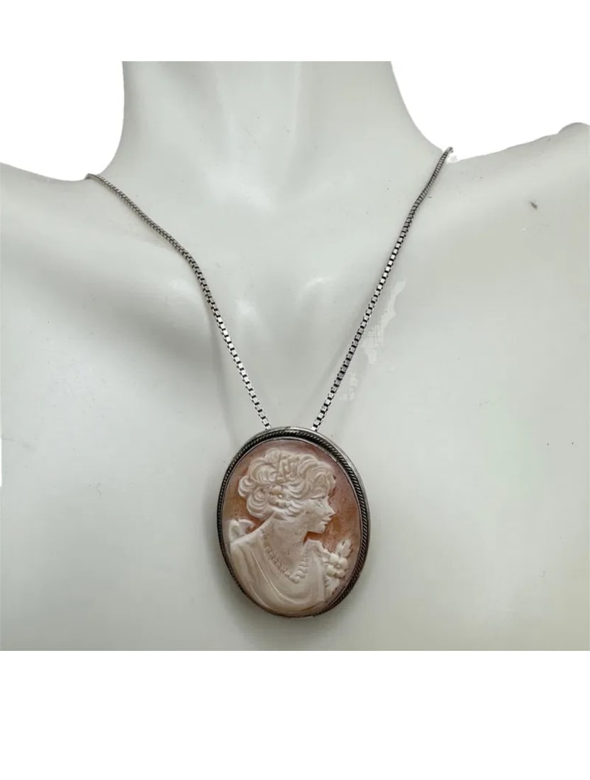 Italian Antique hand carved shell cameo, on sterling Silver Chain Pendant/Pin marked 925 Italy: Antique hand carved shell cameo on sterling Silver Chain 925 Italy Pendant/pin chain measurements in photos cameo:1"Hx1"W **IN HOUSE SHIPPING offered on this lot