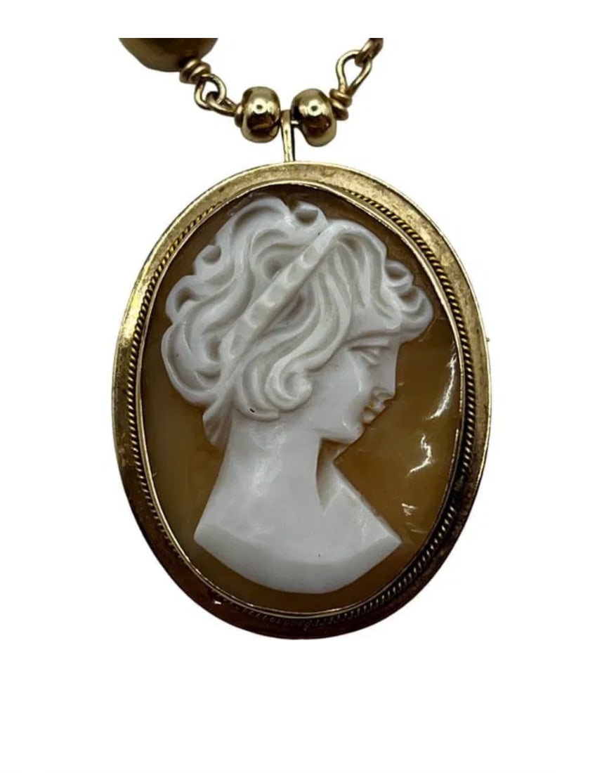14K Gold Cameo Pendant/Pin On Cultured Pearl Strand Necklace: Beautiful 14K gold cameo on cultured Pearl strand Height of cameo: 32.83mm. Length of cameo: 26.20mm. Length of necklace clasped: 10.5” Weight of pendant: roughly 4.7 grams. Total lot weight: 36