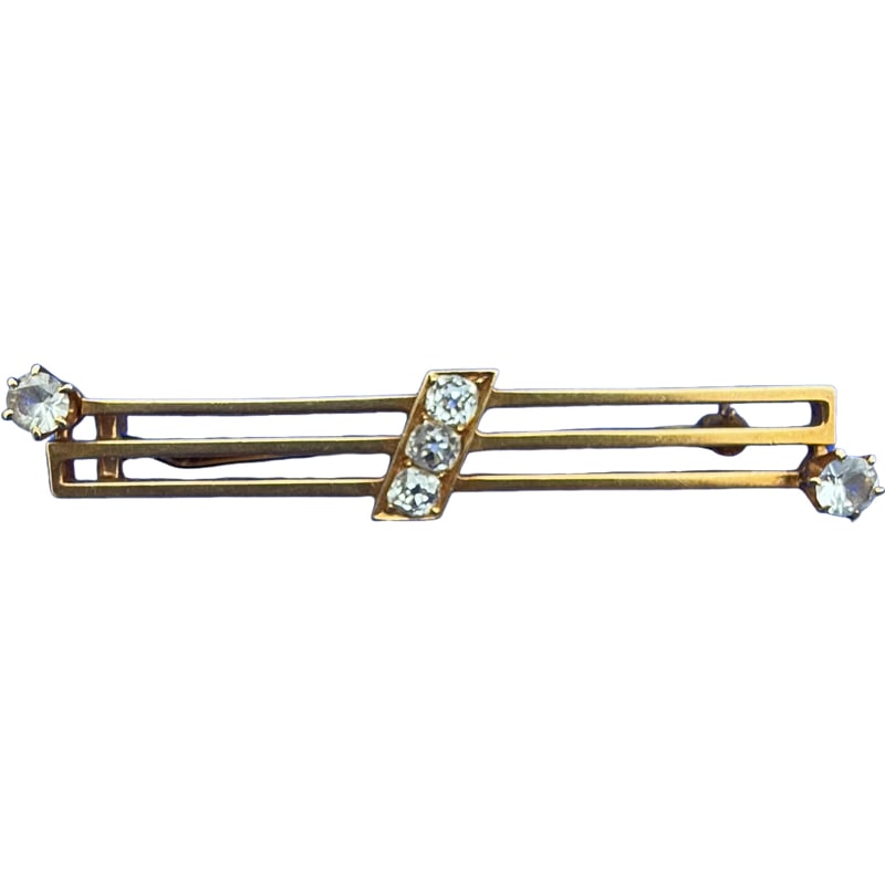 18K Gold Tiffany and Co Brooch with Mine Cut Diamonds and White Sapphires: Amazing 18K Gold Tiffany and Co Brooch with Diamonds and white sapphires. 3 mine cut diamonds in middle and single white sapphires on each end. Has been tested. from The Charleston Living Estate of Ly