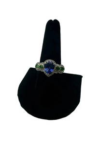 14K Yellow Gold Park Avenue Collection with Tanzanite, Tsavorite Garnet and White Diamonds: 14K Yellow Gold Park Avenue Collection with Tanzanite, Tsavorite Garnet and White Diamonds Ring Size 7 Weight: 5.62 Measurement of tanzanite: 9.45mm x 7.53mm Measurement of one tsavorite garnet: 2.65m