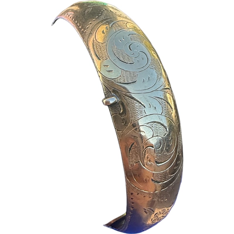 14K Gold Bangle Bracelet: Charming 14K gold bangle bracelet. With beautiful etchings. Bracelet size: 6" Width: 13.80mm Weight: 15.80 grams **IN HOUSE SHIPPING offered on this lot
