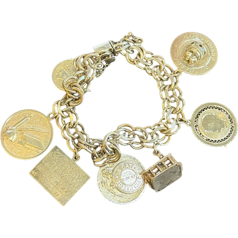 Sterling Silver Bracelet with Sterling Silver Charms: Sterling silver bracelet with charms. 4 of the charms are sterling silver. Total weight w/ all charms: 61.75 grams **IN HOUSE SHIPPING offered on this lot