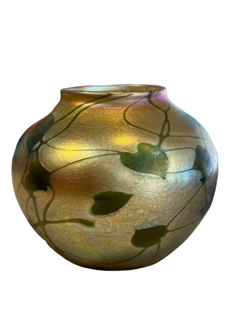 LCT Tiffany Favrile Hearts & Vines Art Glass Vase: Tiffany Favrile Glass HistoryLouis Comfort Tiffany, son of Charles Lewis Tiffany, founder of the Tiffany & Co. luxury jewelry brand, developed and patented Favrile glass in 1894. He took his inspirati
