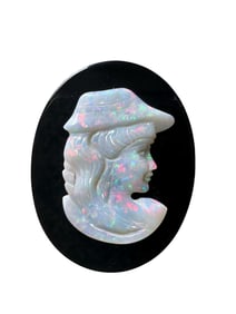 Antique opal carving cameo mounted on the onyx plaque.