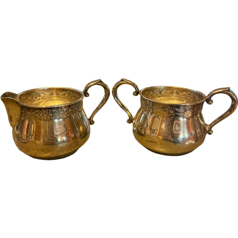 Towel Sterling Silver Creamer and Sugar Set: Towel Sterling Silver Creamer and Sugar Set Measurements of creamer: 3” H x 4.75” L Measurements of sugar: 2.75” H x 5.25” L Total Weight: 152.2 grams **IN HOUSE SHIPPING WITHI