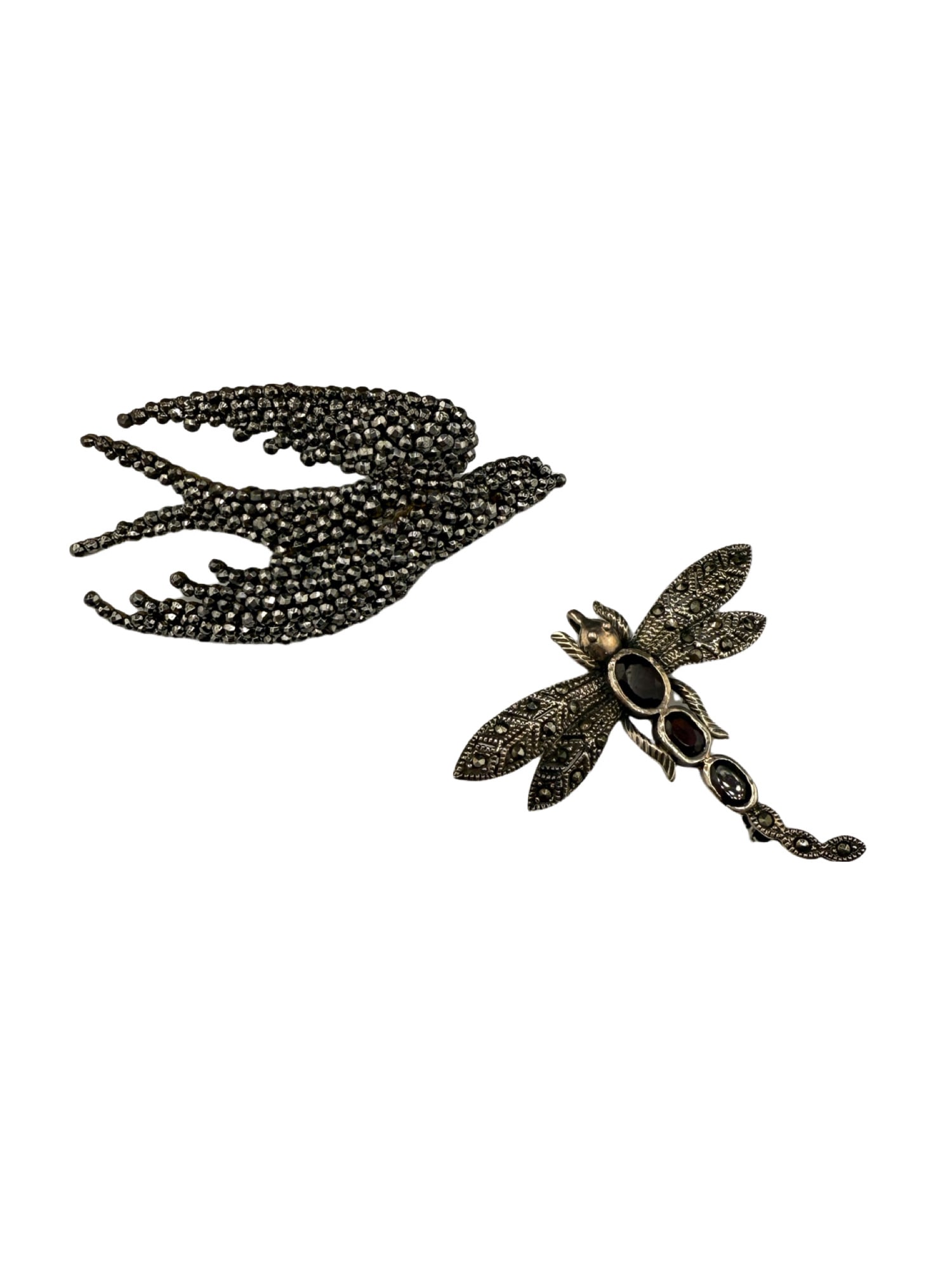 Marcasite Bird Pin and Sterling Silver Dragonfly with Marcasite and Garnet: Marcasite Bird and Sterling Silver Dragonfly with Garnet Stones wine red in color Bird: 16 grams, ~3 inches x 1.5 in. Dragonfly: 7.4 grams, 2 in. x 2 in. In house shipping within the US.