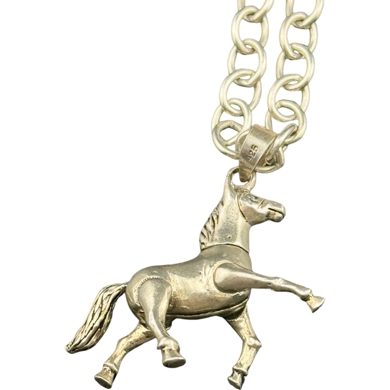 Sterling Silver Horse Pendant - Moving Galloping Horse on Chain: Sterling Silver Horse Pendant - Moving Galloping Horse on Chain Horses head, legs and tail moves Pendant is sterling weighing approx 10 grams chain clasped 8" chain unclasped 16" **IN HOUSE SHIPPING W