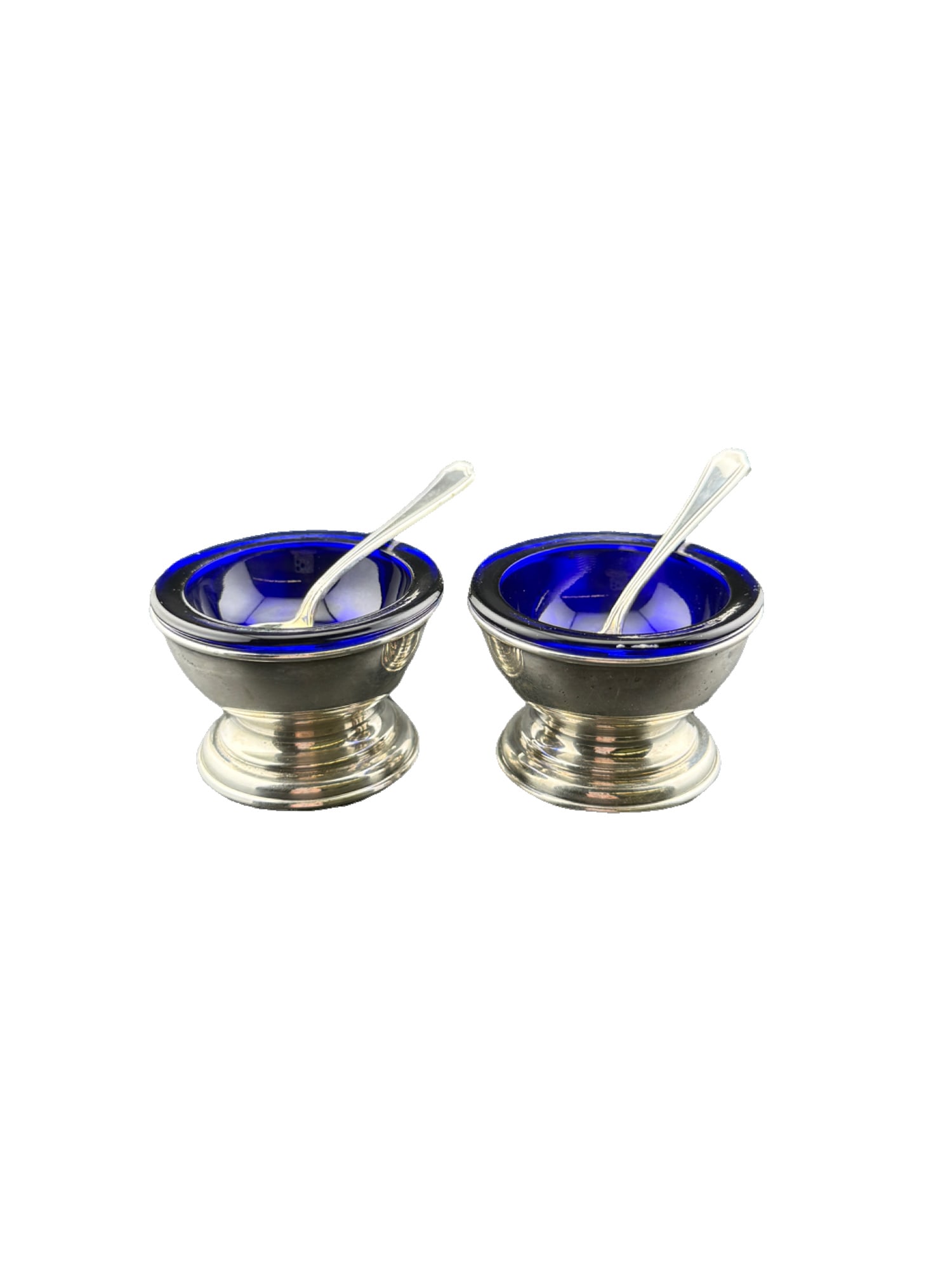 Sterling Silver Cobalt Blue Glass Salt Cellars with Spoons: Sterling Silver Cobalt Blue Glass Salt Cellars with Spoons Measurements Salt Cellar: roughly 1.5"H x 2"W Spoons: 2.5 in. Weights: Salt Cellar (without glass): 22.9g Spoons: 9.4g From the estate of Pet
