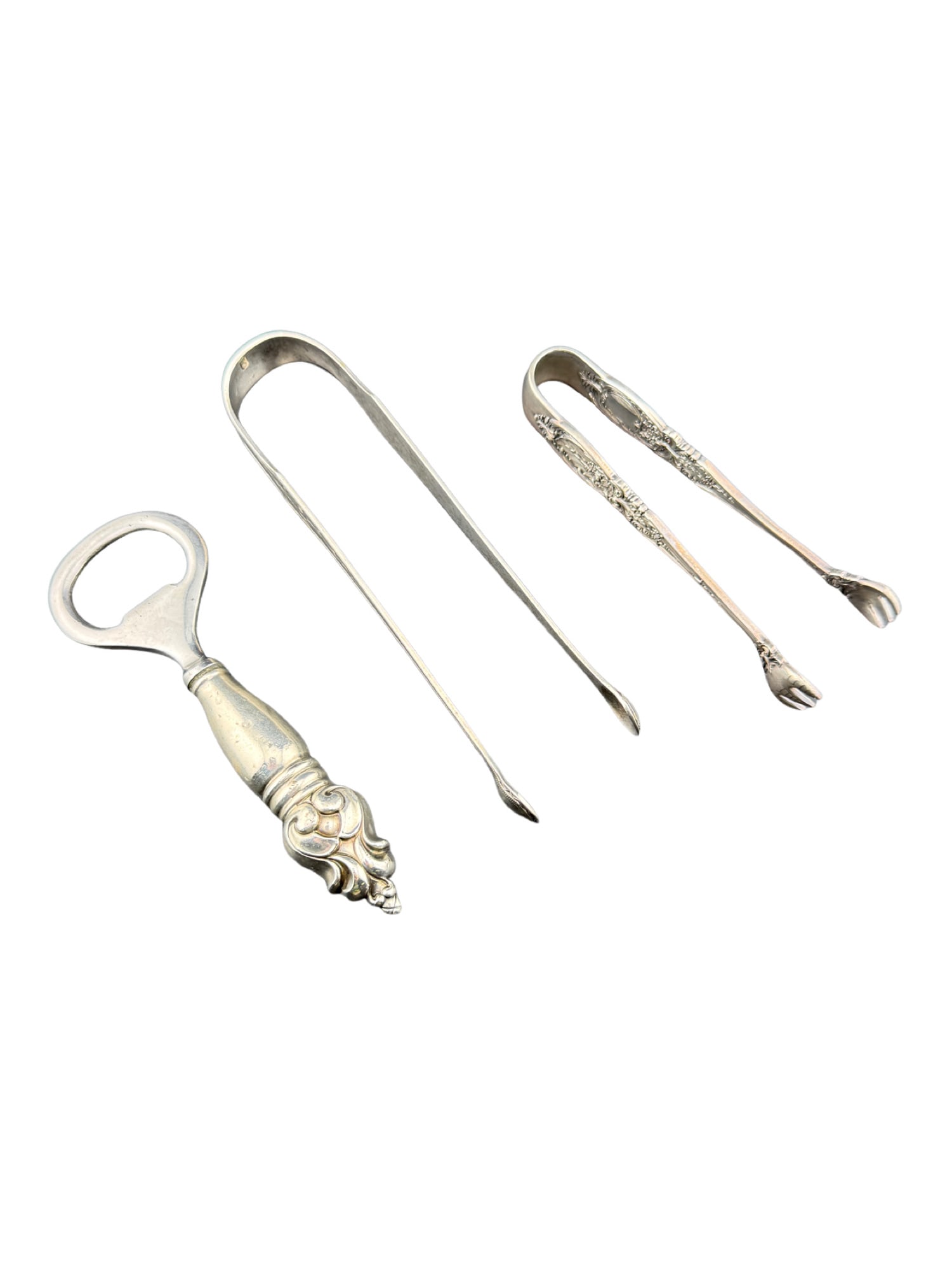 Sterling Silver Tongs and Bottle Opener: PLEASE READ in house shipping If you win this item, please select self arranged for in house shipping when paying invoice Sterling Silver Tongs and Bottle Opener Shorter tongs: 39 grams, 4" Longer ton