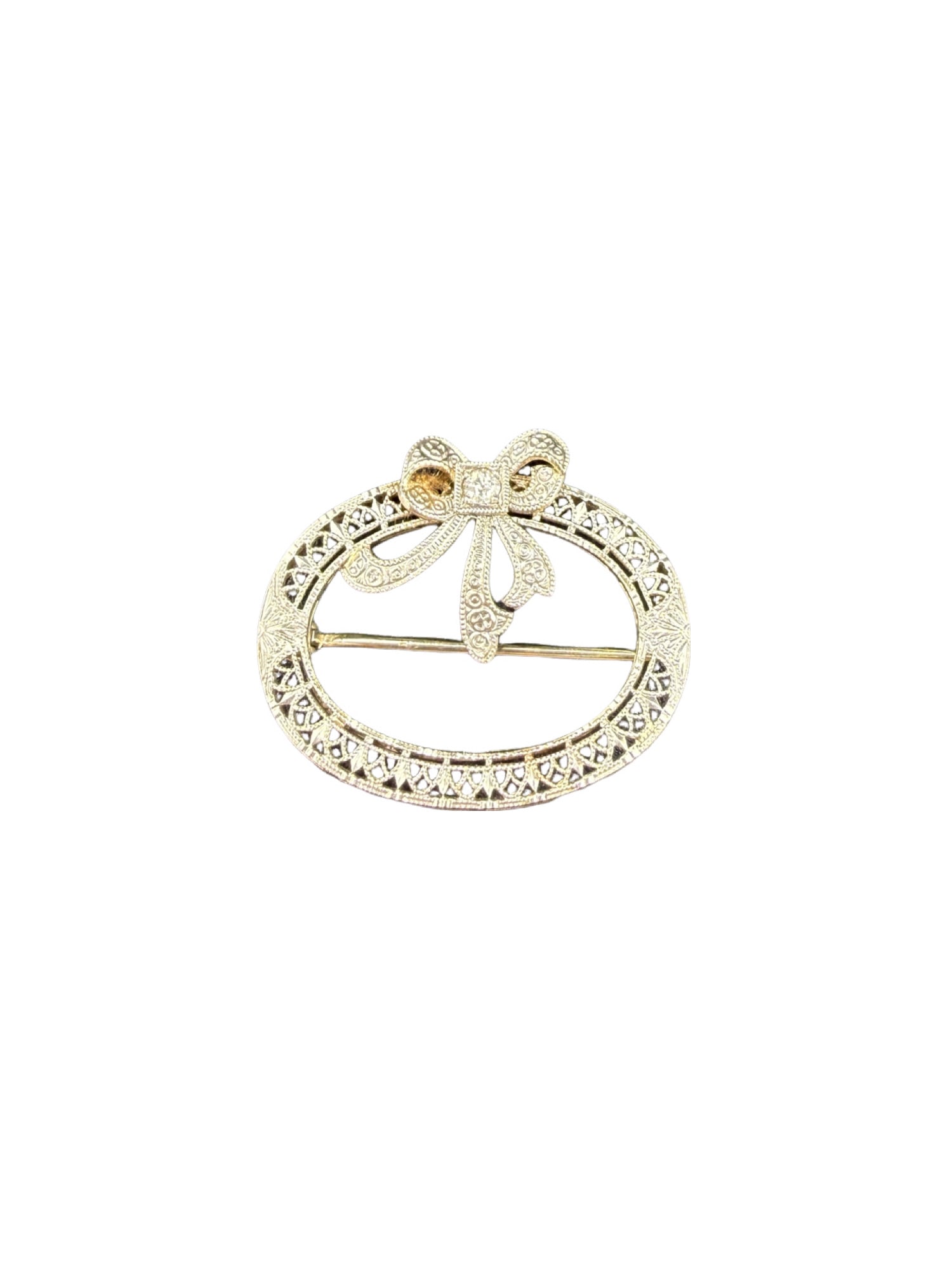 Filigree Circle 14k and Diamond Bow Brooch: PLEASE READ: in house shipping within the US If you win this item, please select self arranged for in house shipping when paying invoice Filigree Circle 14k and Diamond Bow Brooch 2.6 grams 1"