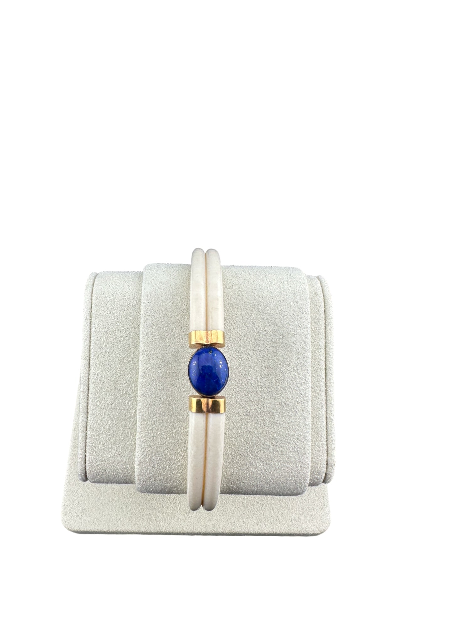 14K GOLD BRACELET bone WITH LAPIS LAZULI: PLEASE READ:in house shipping within the us If you win this item, please select self arranged for in house shipping when paying invoice A 14k yellow gold bangle bracelet bone with a bezel set oval cab