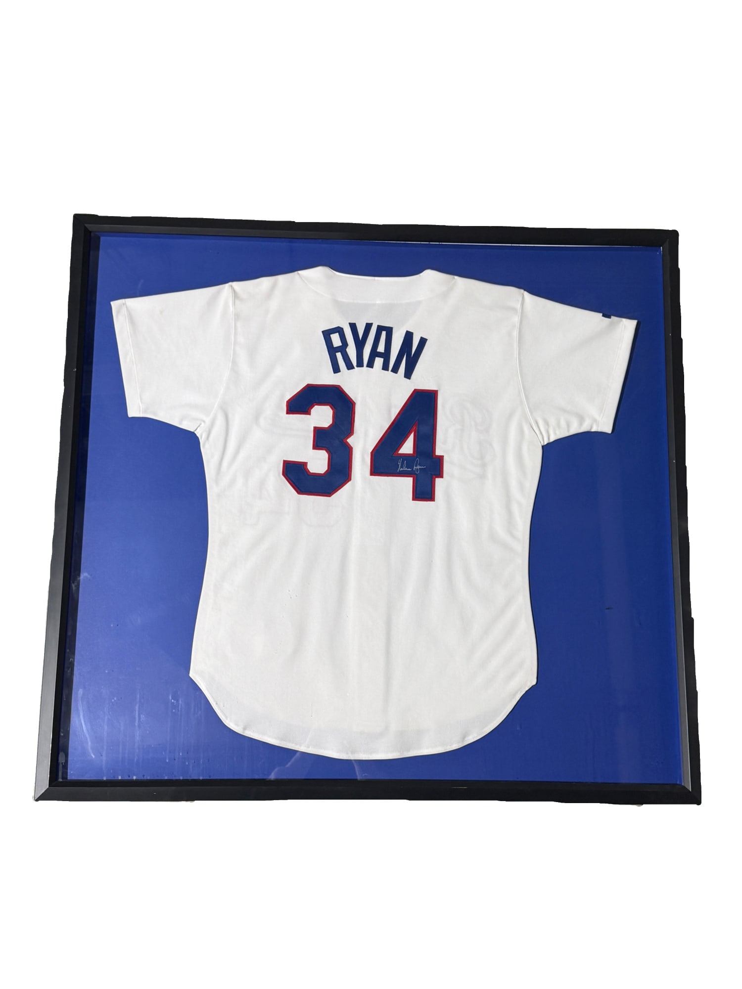 Autographed and Framed Nolan Ryan Texas Rangers Jersey: **OUT OF HOUSE SHIPPING Autographed and Framed Nolan Ryan Texas Rangers Jersey Nolan Ryan played for the Rangers from 1989 to 1993. 40"L x 43"W In plexiglass