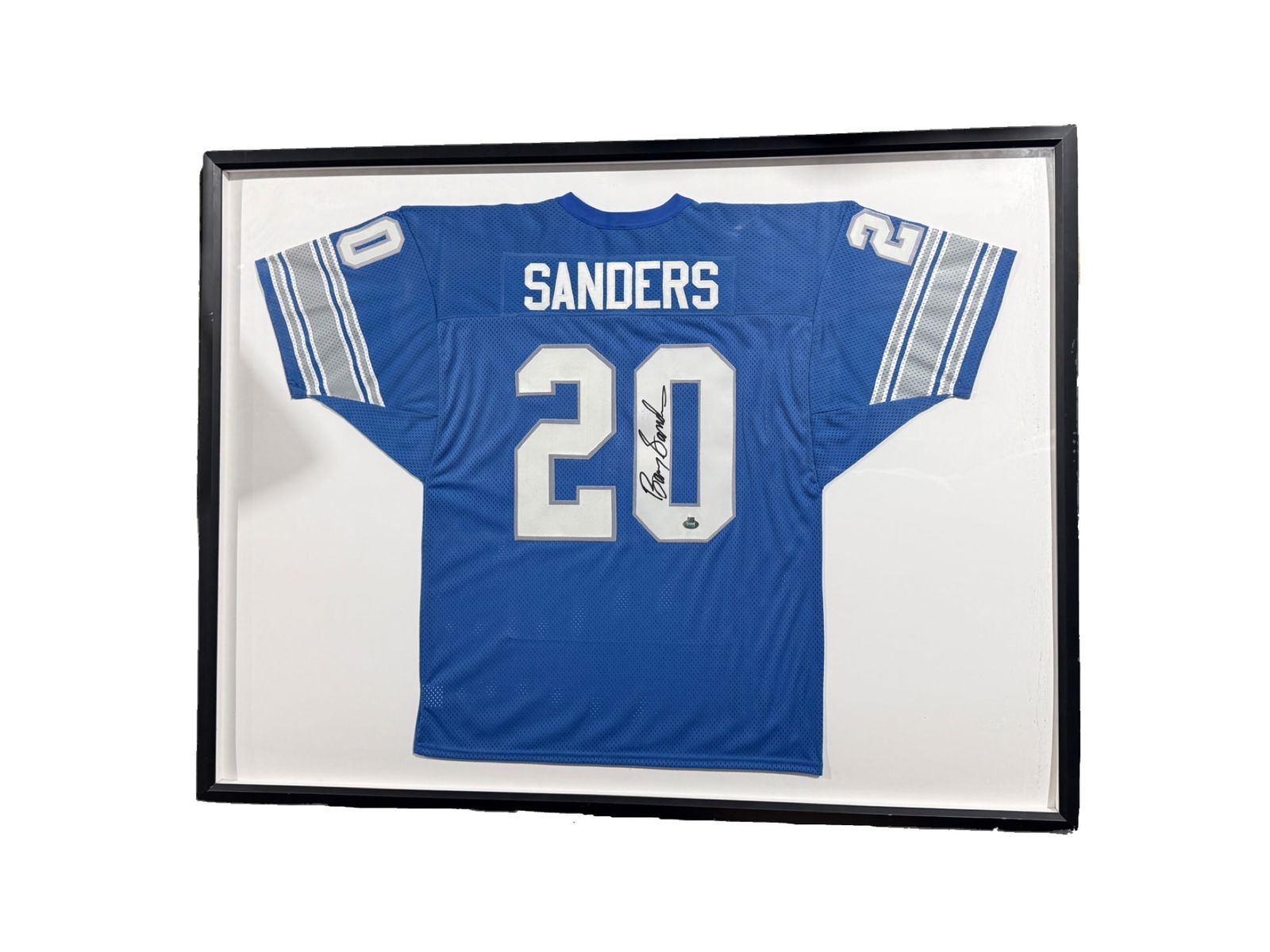 Autographed and Framed Barry Sanders Detroit Lions Jersey: **OUT OF HOUSE SHIPPING Very Large Autographed and Framed Barry Sanders Detroit Lions Jersey Barry Sanders is a Pro Football Hall of Fame running back, and played for the Detroit Lions from 1989-1998.