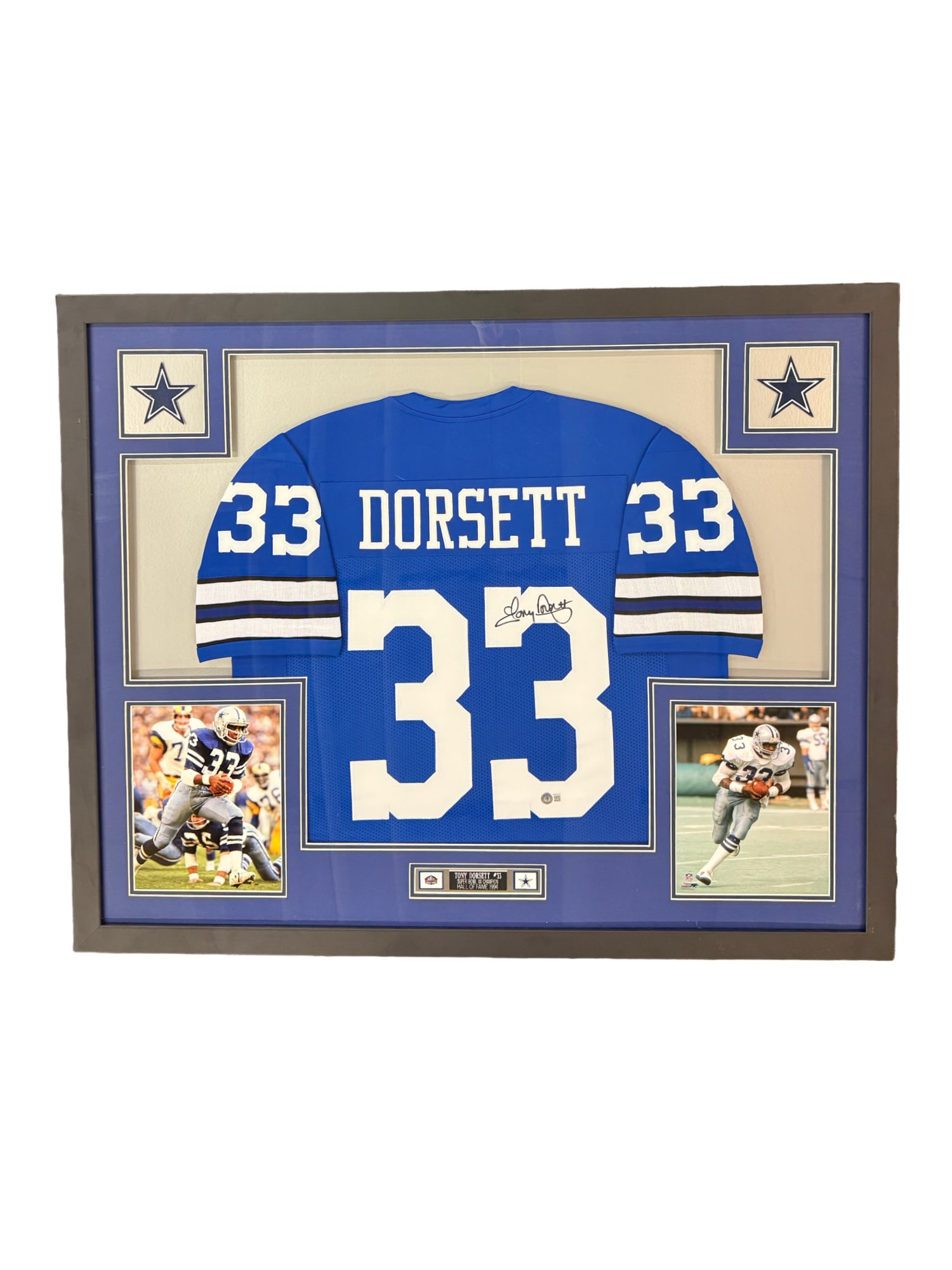 Autographed and Framed Tony Dorsett Dallas Cowboys Jersey: **OUT OF HOUSE SHIPPING Autographed and Framed Tony Dorsett Dallas Cowboys Jersey The autograph is Beckett Certified. Includes 2 licensed photographs and 2 stitched team logo patches 34.5"L x 42.5"W I