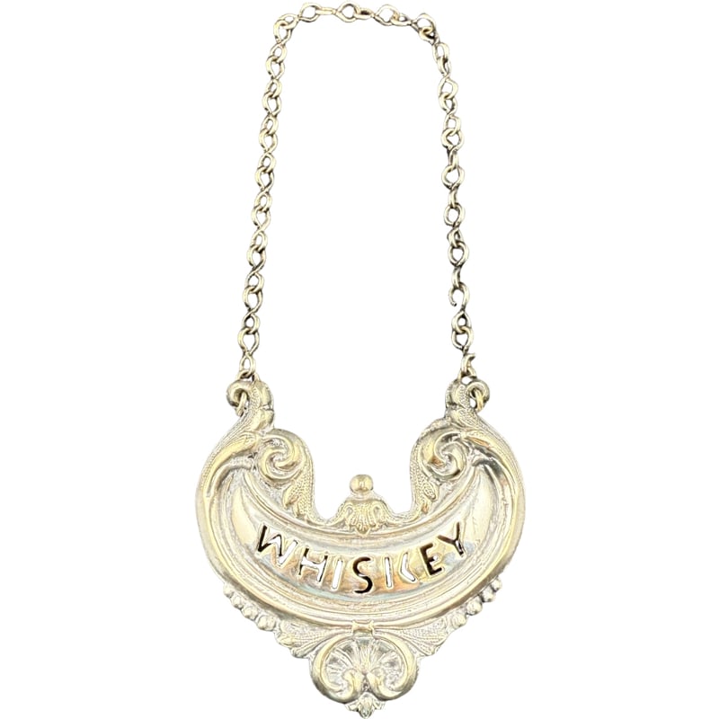 Sterling Silver ?? Whiskey Decanter Tag: PLEASE READ: In house shipping within the US. If you win this item, please select self arranged for in house shipping when paying invoice 2.25" 15 grams not marked sterling but does not stick to magne
