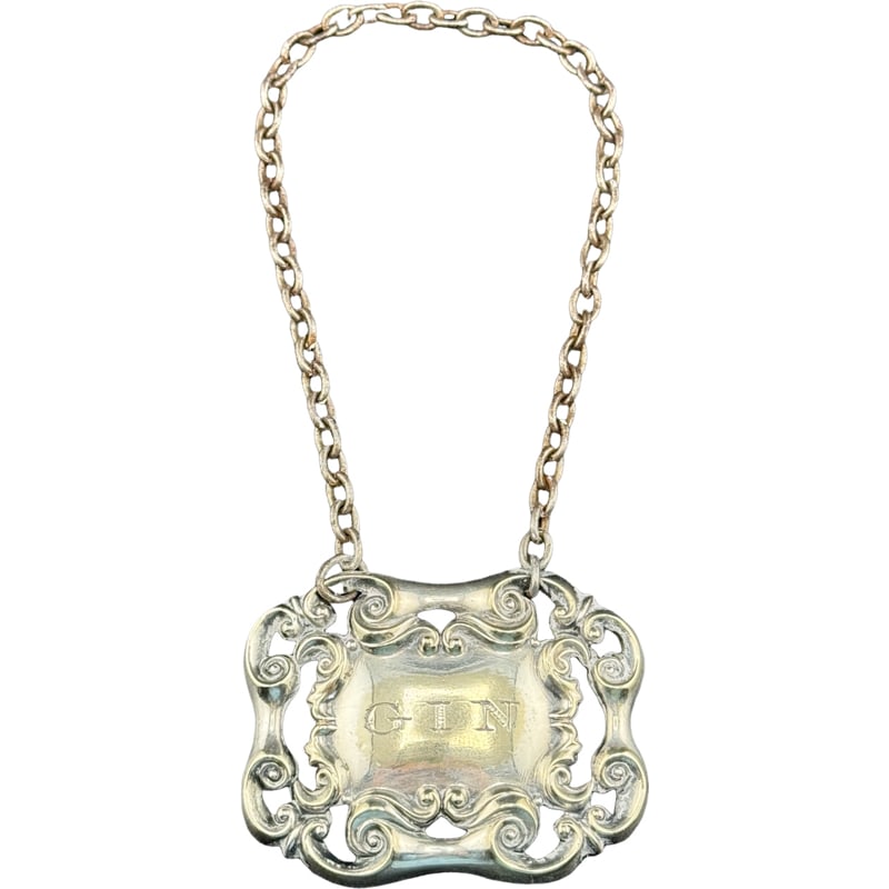 Sterling Silver ?? Gin Decanter Tag: PLEASE READ: In house shipping within the US. If you win this item, please select self arranged for in house shipping when paying invoice 2" 12 grams not marked sterling but tag does not stick to magn