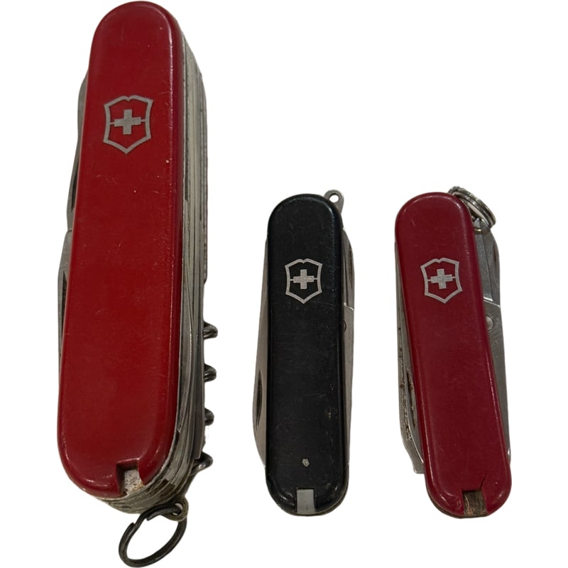 Lot of Three Vintage Victorinox Ranger Red and Black Swiss Army Knife: PLEASE READ: in house shipping within the US If you win this item, please select self arranged for in house shipping when paying invoice larger: 3.5" smaller: 2.25" From the Charleston Estate of