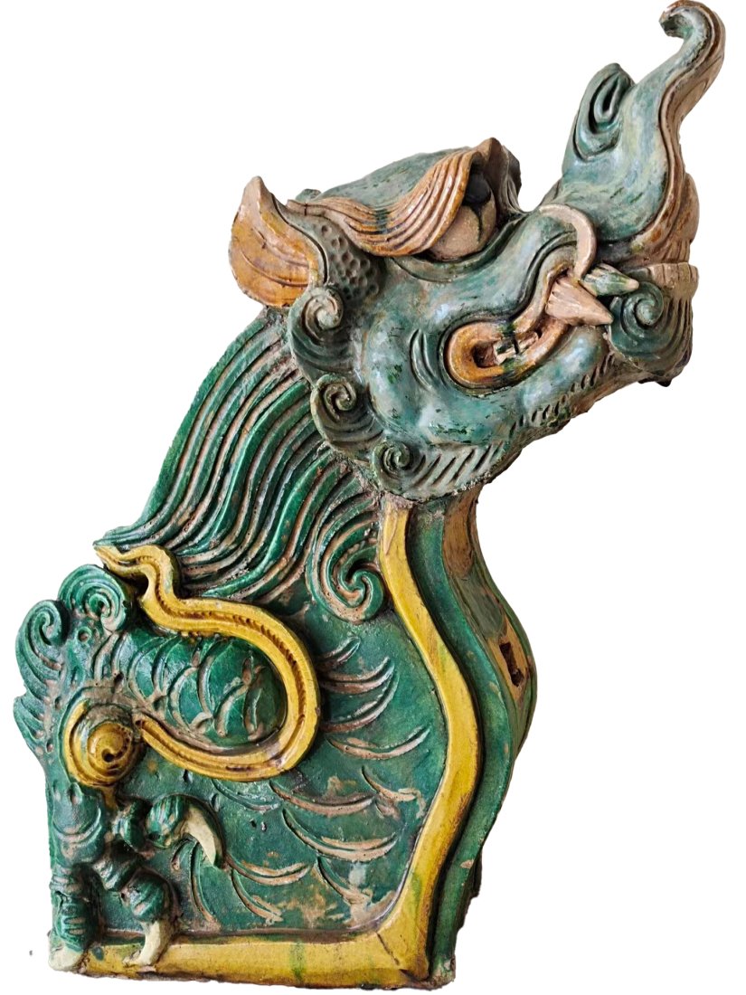 A PAIR OF TRICOLOR GLAZED BEASTS "DRAGON HEADS" IN THE YUAN DYNASTY (1 of 4)