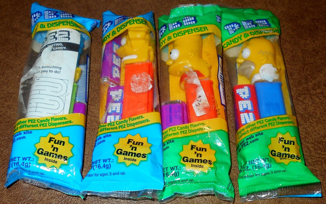 Pez Lot: Four different Simpsons pez, sealed with candy. see photos.