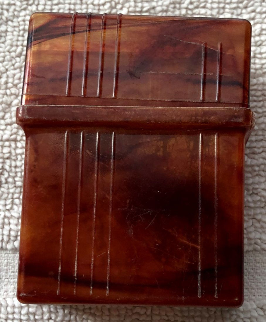 Cigarette Holder: Plastic cigarette pack holder, see photos.