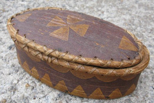 Oval Birch Bark Box attributed to T. Joseph: This 6 x 3 x 2 inches high birch bark box is late 19th century with bark art etchings including half circles and triangles along the top and bottom edges, similar as used by Passamaquoddy Indian Tomah