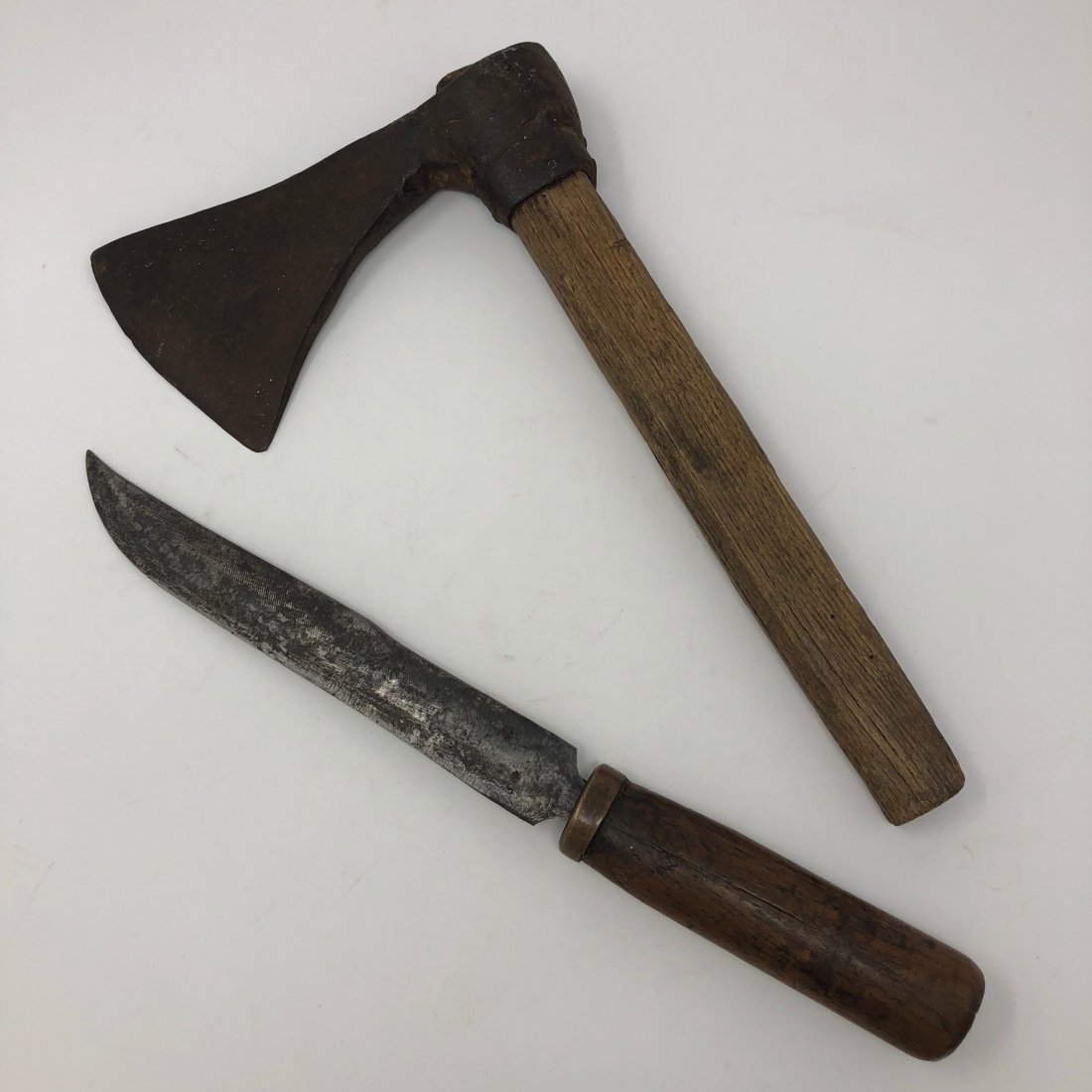 Early Hand Forged Axe and Primitive File Steel Knife: The axe has an old haft that looks to be from its period of use, and the axe head blade has the style of a Missouri War Axe or Viking Axe, but is probably an early European axe from Colonial Spain or