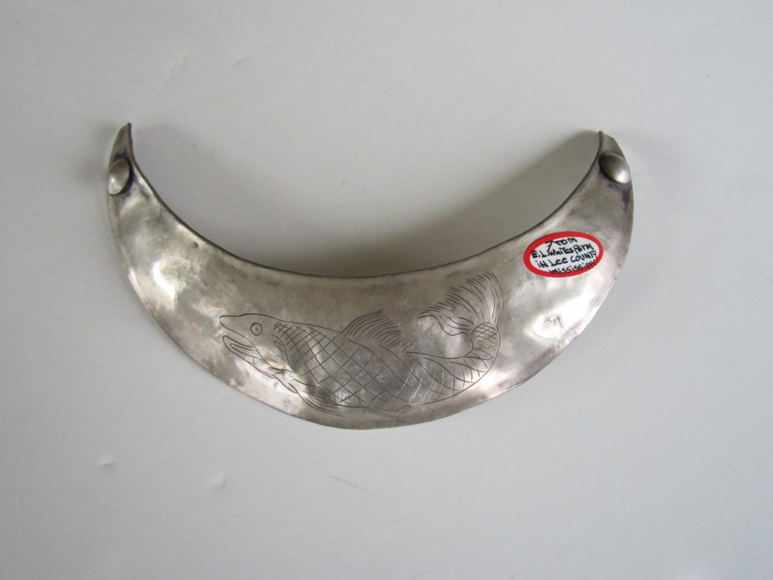 Trade Silver Gorget: This gorget is 6.6 inches wide and incised on the front with a 3.25 inches long fish . It is 3.75 inches high, and touch marked C.A which is Charles Arnoldi, 1779 - 1810, Montreal, Canada. Only the to