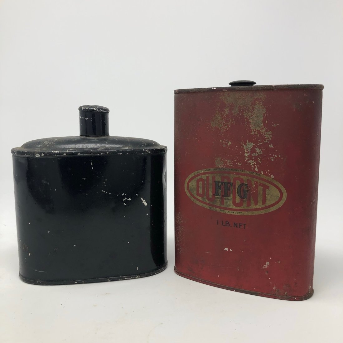 Two Metal Powder Cans. (M578): Two metal Black-Powder Gun Powder Cans. Both have their caps. Tallest (Dupont) is 5 1/2” tall. [ Third party shipping-see Terms for local shippers. ]