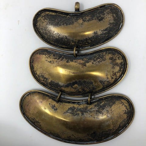 English Officers Gorgets: Three (3) English Officers Gorgets (or Indian trade) suspended in graduated sizes. Not engraved, heavily patina and nice wear (silver wash plated). Possibly Seminal Indian, circa. 1800-1812. Largest 4