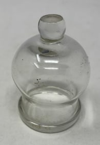 18th Century Glass Bleeding Cup: Revolutionary War era American blown glass bleeding cup as used in blood letting. 3” tall x 2" dia, nice example, no damage. Pontil on top and a folded foot around the base. c. 1760 - 1780. (C-7