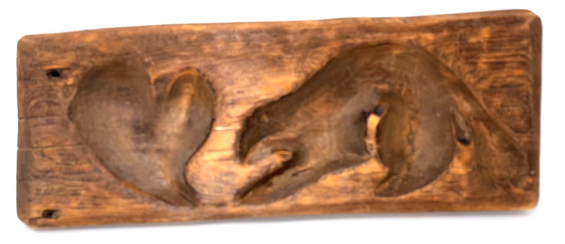 Sugar Mold Deeply Carved, Heart And Beaver: A sugar mold having a deeply carved Heart and a Beaver. Red pine, 14” long x 5 1/2” wide, slightly tapered thickness, 1 5/5” to 1 1/4” thick. The carved figures are ~1