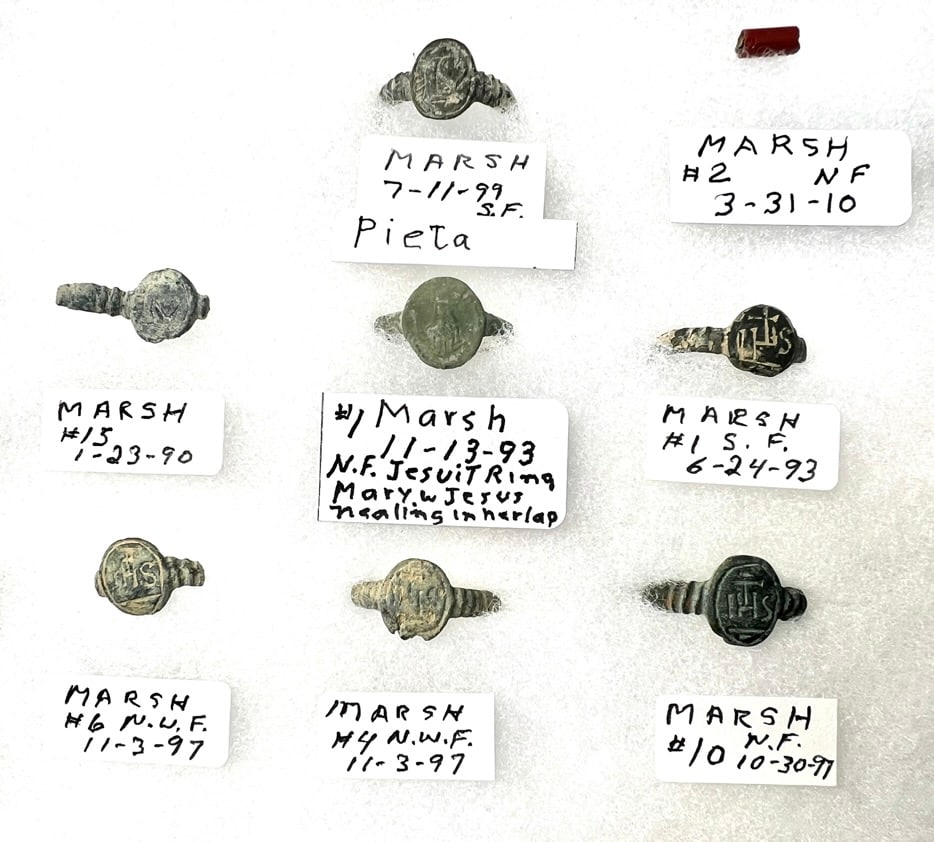 New York State Iroquois Jesuit Trade Goods: A collection of New York state Iroquois Jesuit trade items from early village sites, documented. The items include Jesuit rings, medals, crosses, coins-French Liards, lead fur trade bales seal pcs,