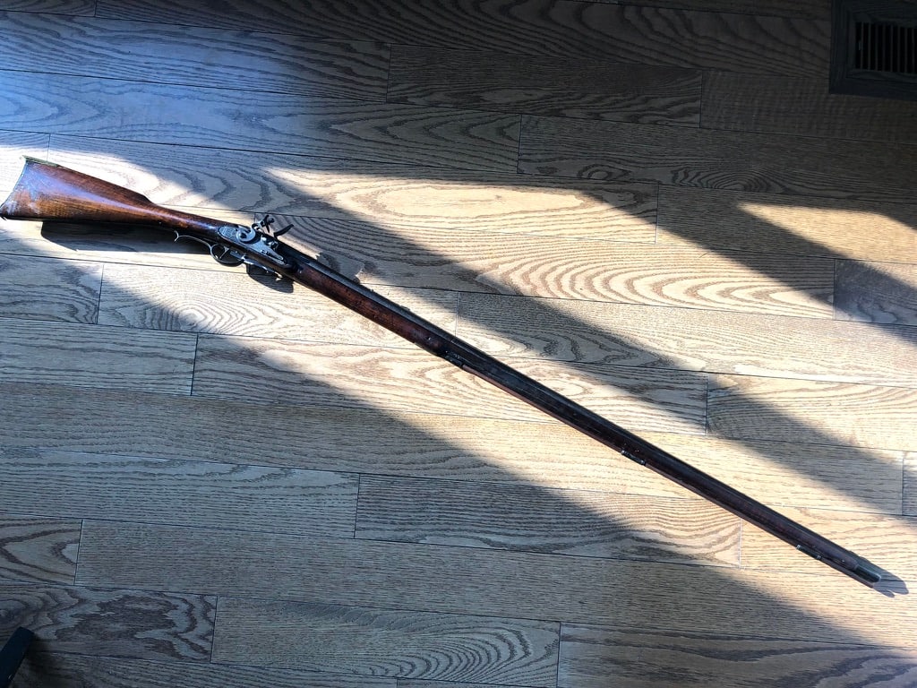 Lancaster Full Stock Flintlock Fowler: A Lancaster full stock flintlock fowler, marked J. Edmonds / Warranted on the lock. circa. 1800. The smoothbore barrel is oct./rd. ~.60 cal., 43 1/4” long, and the gun is 59” o/a. The stoc