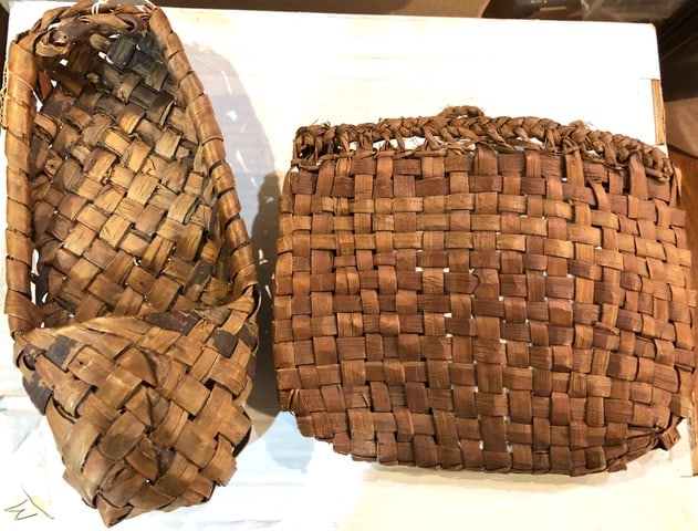 Two Ottawa Indian Woven Cedar Bark Items: Two scarce Ottawa Indian woven cedar bark items from the Roy Robinson collection. One is a single woven moccasin slipper/shoe and the the other is a rare woven berry bag. Both are exc. in condition. T