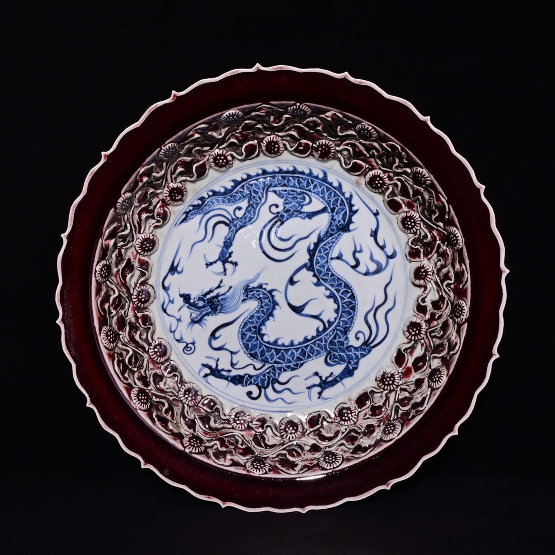 Appreciation plate with Yuan Dynasty style red glaze and blue and white dragon design (1 of 9)