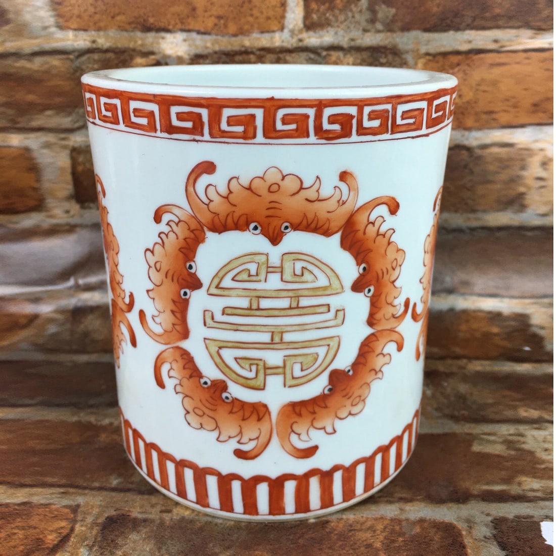 Qing Dynasty Style Enamel Red Five Blessings Holding Longevity Brush Pot: Qing Dynasty style famille-rose enameled pen container with five bats holding the character for 'longevity', diameter 12cm height 13.5cm