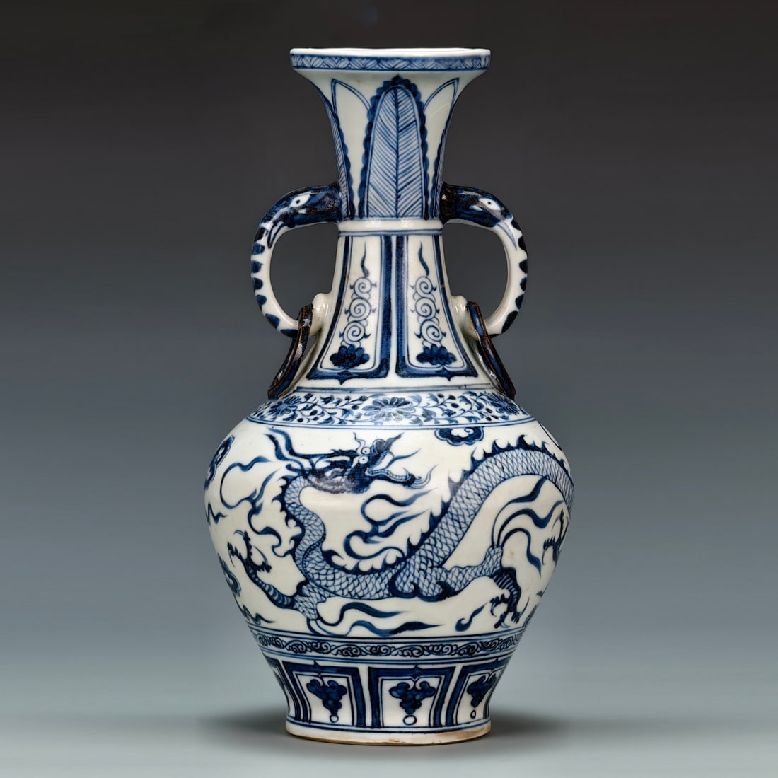Yuan Dynasty Style Full Scene Blue-and-White Porcelain Vase with Dragon Design and Loop Handles: Yuan Dynasty style full scene blue and white dragon through the cloud design with ear bottle, height 31cm width 16.5cm