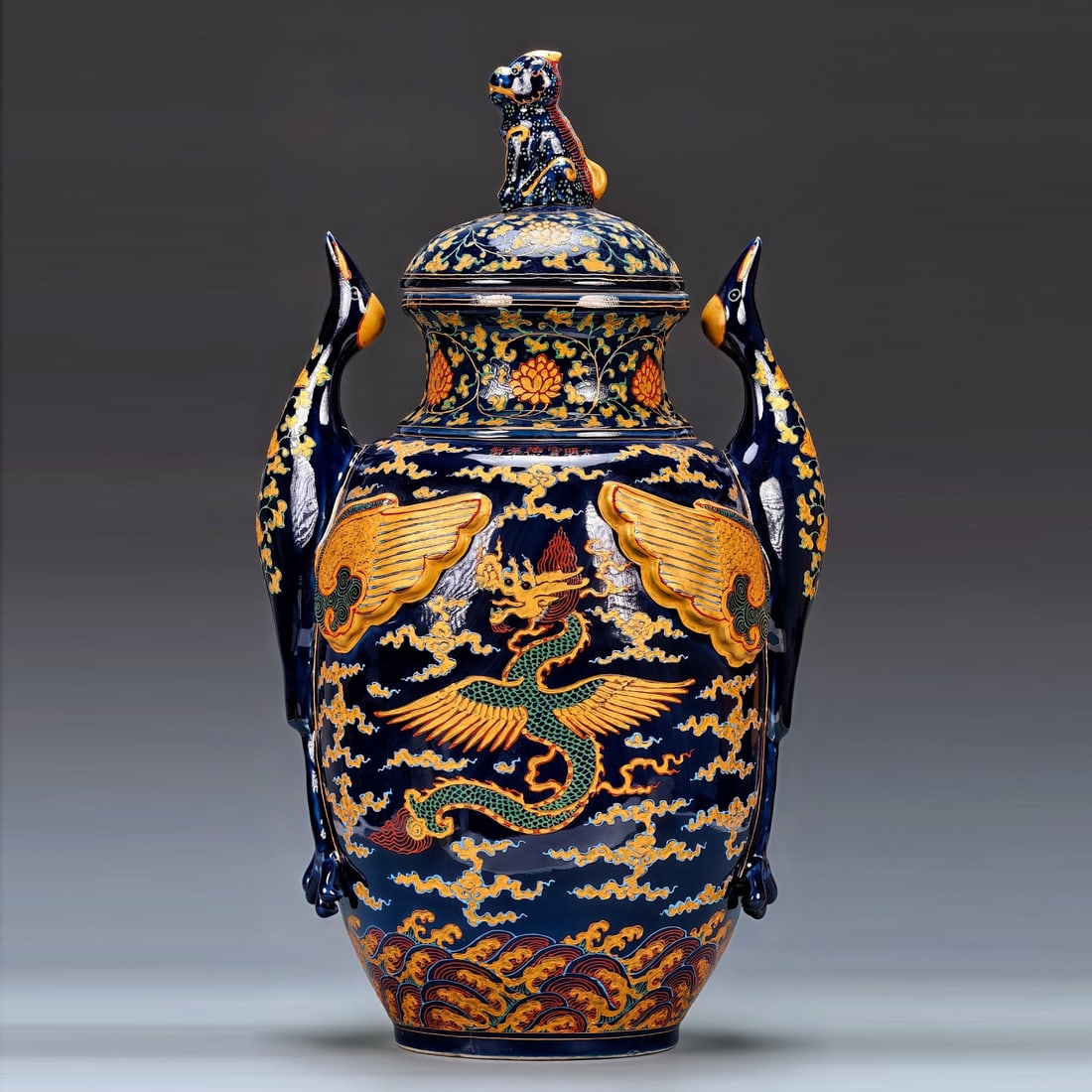 Ming Xuande-style blue-glazed Fahuaxi powder gold-embellished double phoenix and dragon over clouds: The Daming Xuande style gem blue glaze enamel with gold-leafed and double crane clouds design, height 56 width 30 centimeters