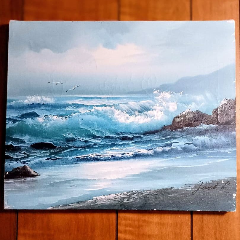 Jack L – Seabreeze of Tijuana, Mexico (47 Years Ago) – Oil on Canvas: This is an original oil on canvas seascape titled Seabreeze of Tijuana, Mexico – 47 Years Ago by artist Jack L. The painting is rendered in rich blue and green tones, capturing the atmosphere of the