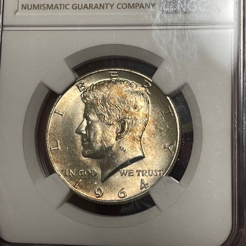 NGC MS63 graded, United States, 1964, Kennedy Half Dollar Silver Coin.: This is a 50-cent silver coin issued in the United States in 1964. The item has been graded by the authentication organization NGC as MS63. Catalog value: Diameter 30.61 millimeters Silver (900) Weigh