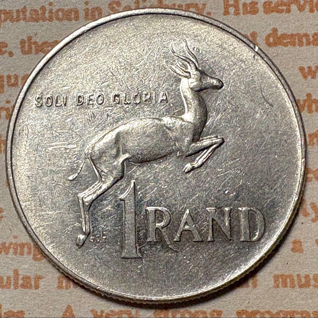 South Africa 1977 1 Rand coin, featuring an antelope design. (1 of 3)