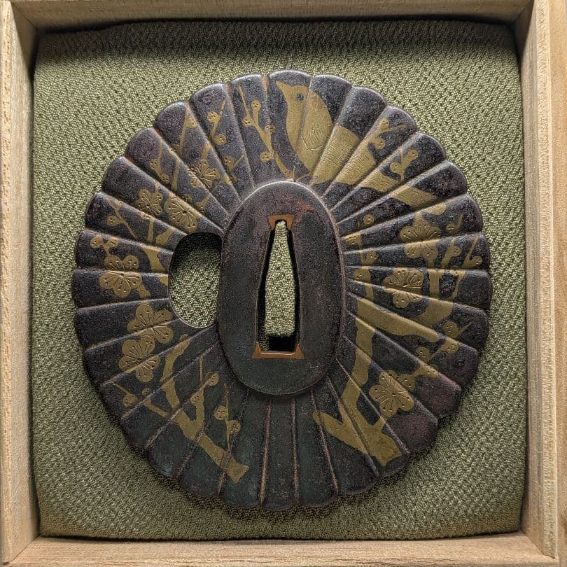 Plum blossom and nightingale chrysanthemum-shaped sword guard. (1 of 7)