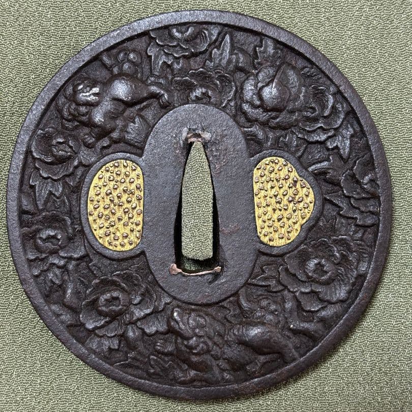 Lion and peony pattern sword guard (jianjin). (1 of 3)