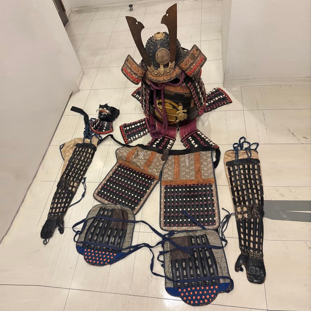 A complete set of samurai armor, replica swords, and battle surcoat. (1 of 4)