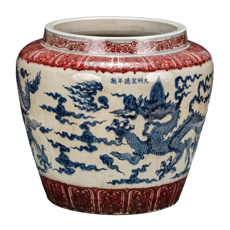 Ming Dynasty Xuande period blue and white glazed red dragon pattern scroll vase: A blue and white glazed red "Cloud-Piercing Dragon" scroll vase made during the Ming Xuande period. It measures 40cm in height and 45cm in width. The craftsmanship of the scroll vase in the picture is