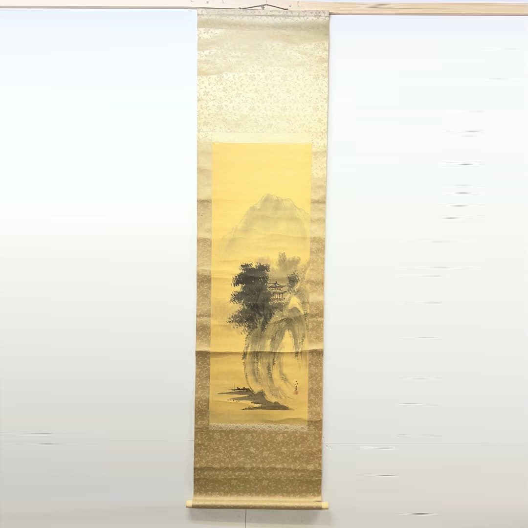 Landscape painting, hanging scroll, Japanese painting, hand-painted on silk.: This is a Japanese painting scroll, featuring a landscape painting on a light yellow background. Technique: Japanese painting Theme: Landscape painting Color scheme: Light yellow and black Mounting di