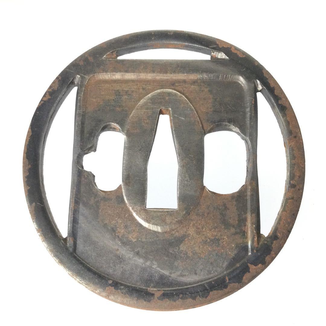 Inkstone design with openwork guard (sword tsuba), Hokuyetsu Bajo Nyudo Chimei: This is a sword guard (tsuba) with an inkstone motif, crafted by Hokue Basha Nyudo Chisho. Iron base Dimensions: Width 7.1 cm, Height 7.1 cm, Thickness 0.4 cm Weight: 84 grams This is an old decorativ