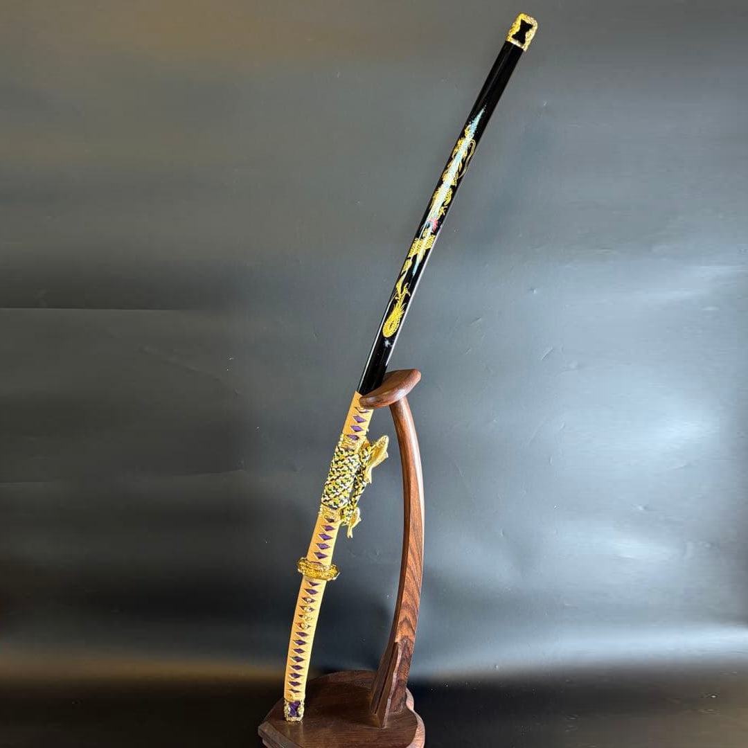 A finely crafted sword, accompanied by a black scabbard, adorned with golden dragon motifs. (1 of 12)