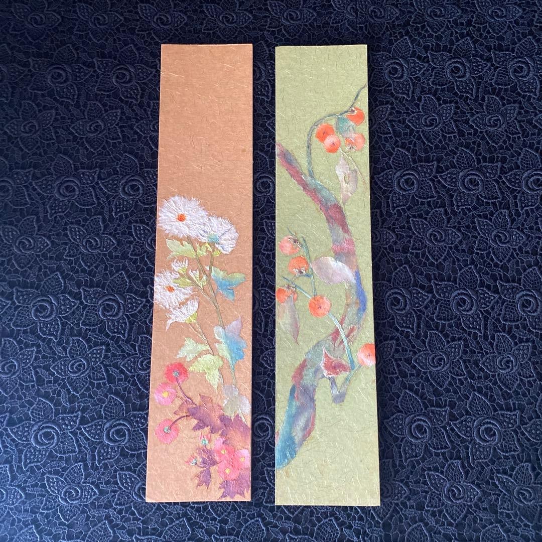 Two short strips of paper with printed patterns. (1 of 7)